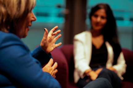 Women sitting at table talking