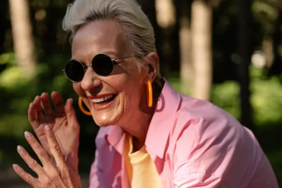 Older woman with sunglasses Older woman with sunglasses in sunshine